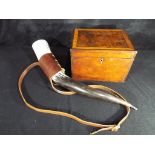 A 20th century drinking horn with tooled leather carrying holster,