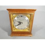 An Elliott mantel clock, retailed by Garrard & Co Ltd, London.