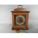 A Westminster bracket clock with Perivale movement, Roman numerals to the dial, with key,
