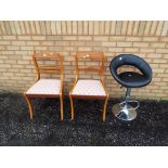 Two vintage dining chairs with upholstered seats and a modern faux leather swivel bar stool.