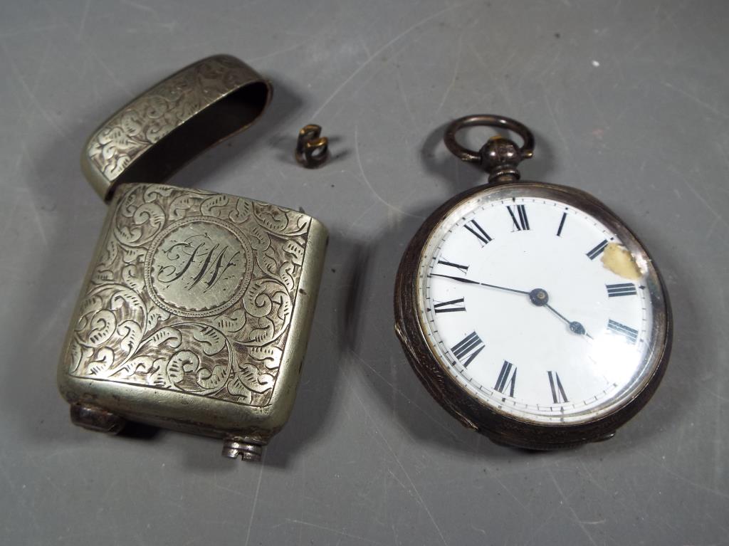 A gentleman's silver cased pocket watch and a white metal cased cigarette lighter