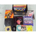 A carry case containing a small quantity of vinyl records to include T-Rex, Black Sabbath, Hawkwind,