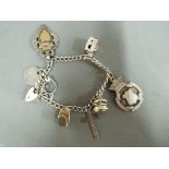 Silver charm bracelet with charms