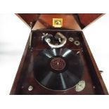 An HMV model 103 table top gramophone, with winder and a quantity of 78 RPM records.