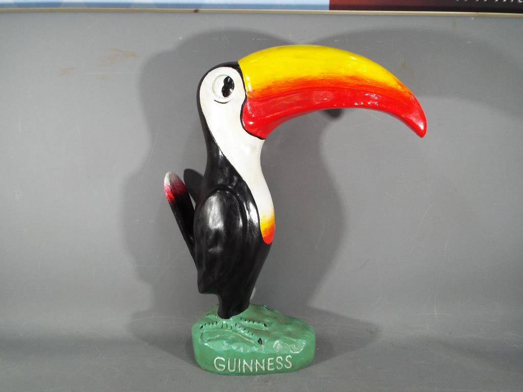 A large resin figurine advertising Toucan by Guinness and measuring approximately 42 cm tall.