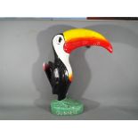 A large resin figurine advertising Toucan by Guinness and measuring approximately 42 cm tall.