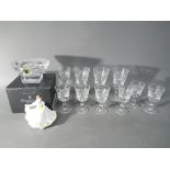 A boxed Waterford Crystal candle holder and a quantity of cut crystal glasses,