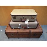 A vintage shipping trunk measuring approximately 36 cm x 100 cm x 57 cm and two suitcases.