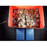 A large quantity of UK and foreign coins, commemorative crowns, decimal coin sets and similar.