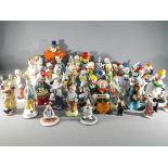 A large quantity of clown figurines to include ceramic, Murano style glass and similar.