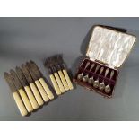 A cased set of George V silver hallmarked coffee spoons,