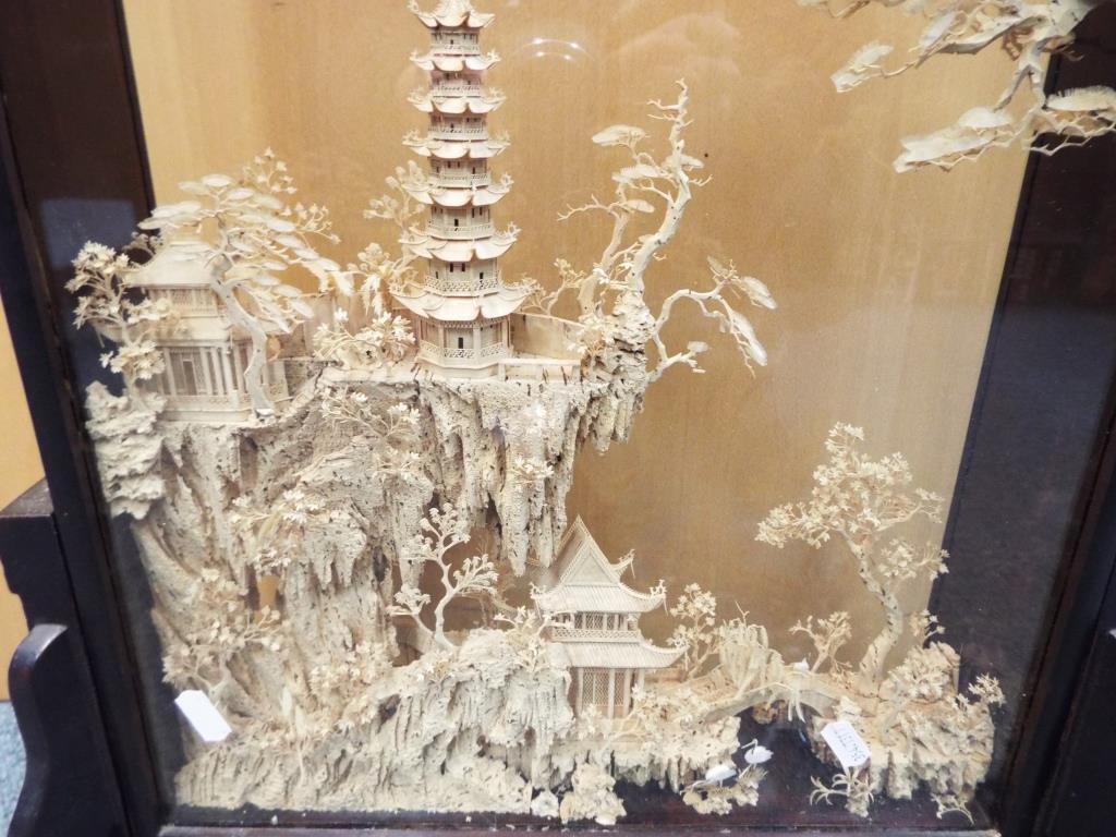 A Chinese carved cork landscape diorama in glazed case, raised on a stand, - Image 2 of 2