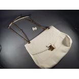 Handbags - a cream colored good quality Lady's handbag,