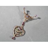 A lady's 9 carat gold brooch set with amethyst, peridot, seed pearls and other,
