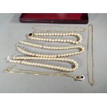 A mixed lot of costume jewellery to include three pearl necklaces,