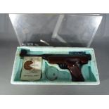 An 'Original' Model 5 .22 cal break action target air pistol contained in original box.