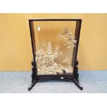A Chinese carved cork landscape diorama in glazed case, raised on a stand,