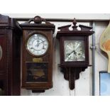 Two wooden wall clocks - one in mahogany, the other in oak case, both with pendulums and keys,