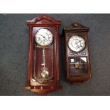 Two wall clocks, one by Wm Widdop the other The Time MFG Co, both with key and pendulum.