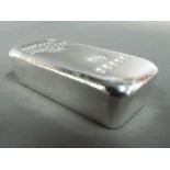 Silver ingot measuring approximately 250 g.
