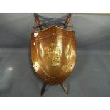 A reproduction shield and swords wall mo