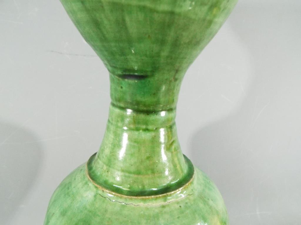 A Chinese Tang dynasty sancai glaze vase of mis-shapen form, unglazed to lower section, - Image 4 of 8