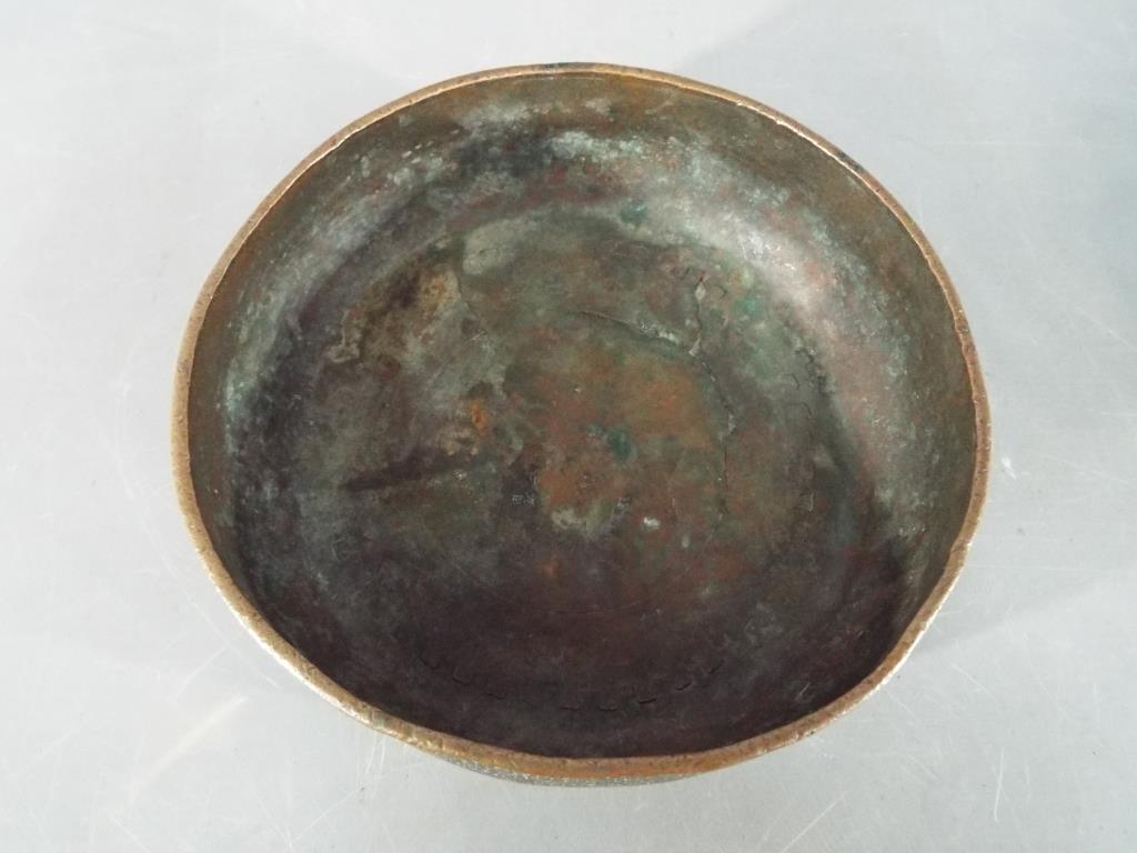 A Persian 14th century Timurid, tinned copper bowl of deep rounded form with slightly everted rim, - Image 2 of 6