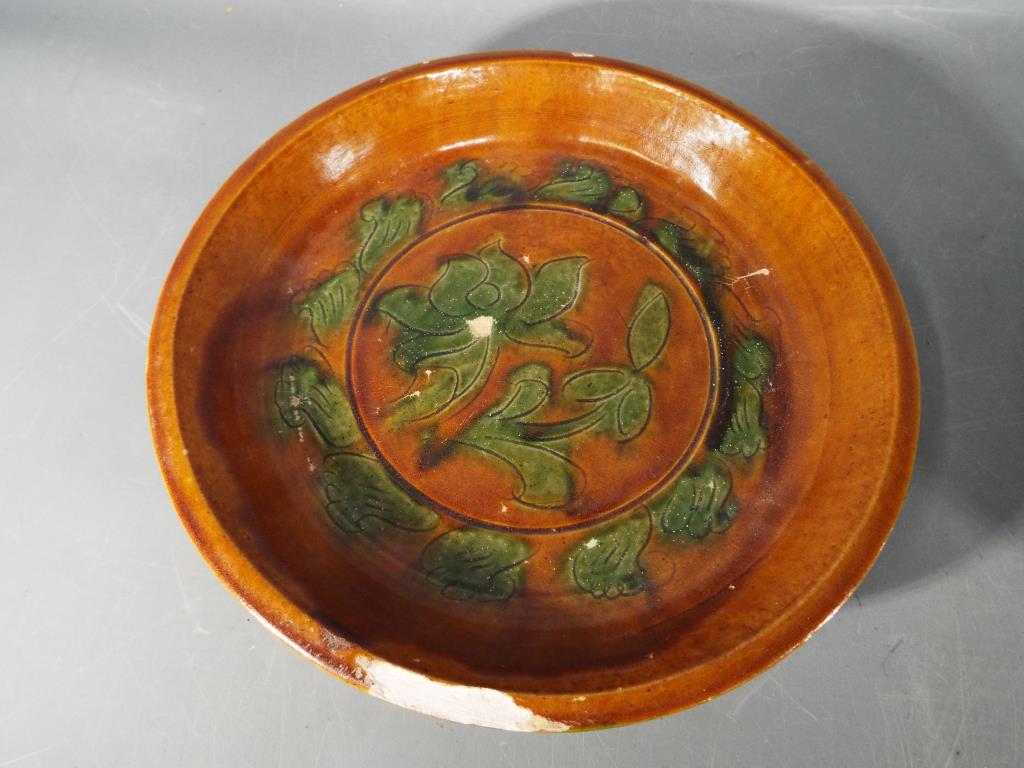 A pair of rare Chinese Tang dynasty sancai glaze terracotta dishes raised on tripod supports with - Image 3 of 6