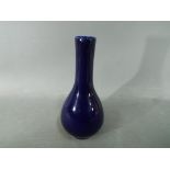 A Chinese deep blue glaze, monochrome, bottle vase Kangxi double circle,