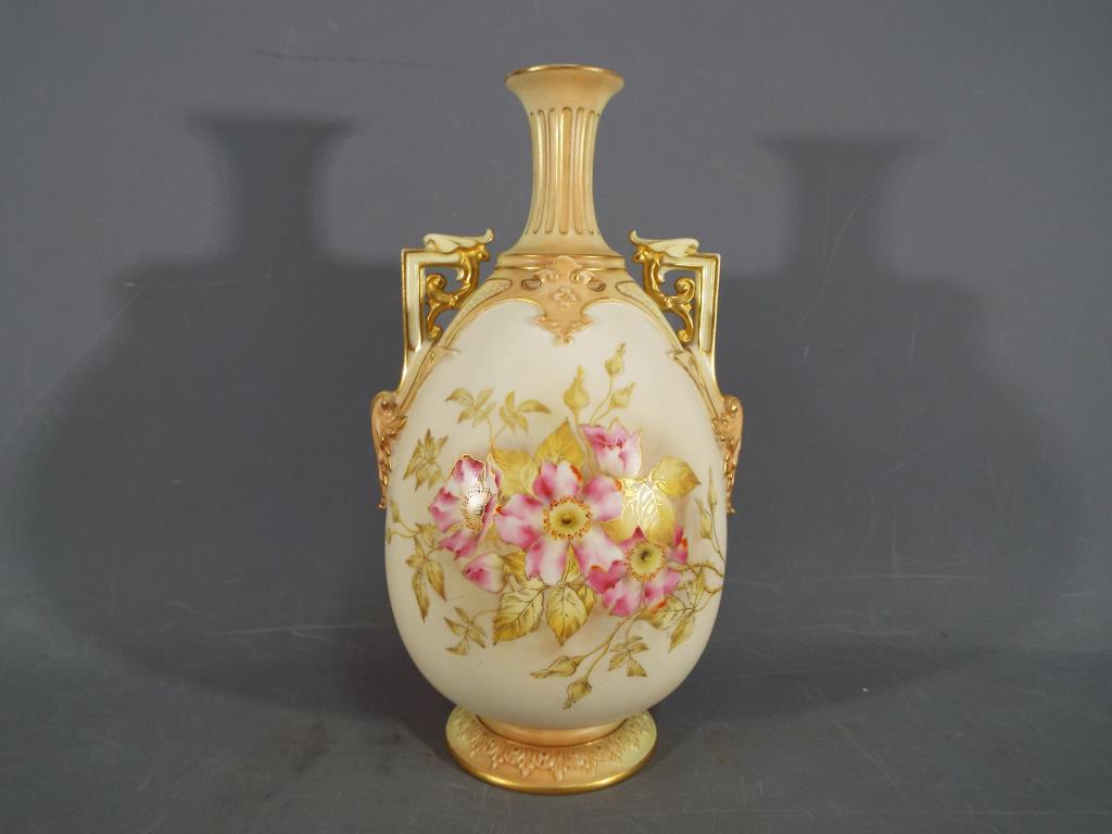 Royal Worcester - A Royal Worcester twin handled blush ivory vase,