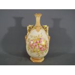 Royal Worcester - A Royal Worcester twin handled blush ivory vase,