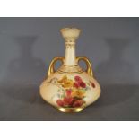 Royal Worcester - A Royal Worcester blush ivory squat vase with twin loop handles, shape 1747,