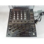 Pioneer - A Pioneer professional audio mixer, model DJM-600, with Decksaver cover.