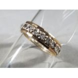 A 9ct gold, grain set, full eternity ring set with paste stones, size M. Approximately 2.