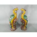 A pair of 19th Chinese sancai glaze figurines depicting Fenghuang (phoenix),