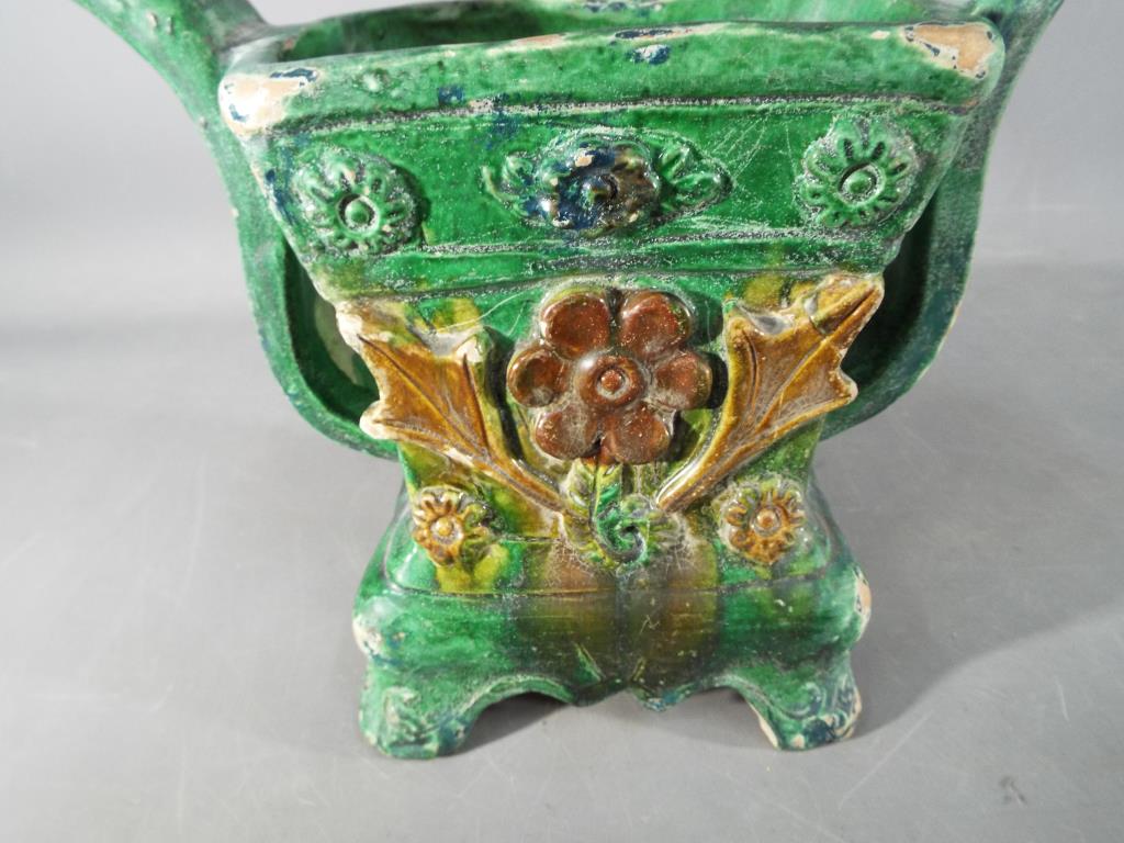 A Chinese Tang dynasty sancai glaze twin handled vessel, with floral decoration, - Image 2 of 6