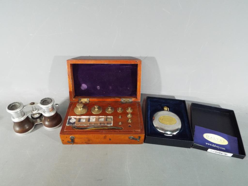 A cased set of Avery Ltd weights, a boxed Dalvey pocket compass and a set of opera glasses.