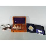 A cased set of Avery Ltd weights, a boxed Dalvey pocket compass and a set of opera glasses.