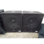 QTX Sound - A pair of QTX Sound speakers with protective covers.