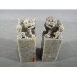 A pair of Chinese grey soapstone carvings depicting Imperial Temple Lions,