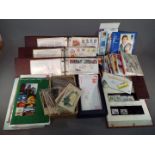 Philately - a quantity of UK first day covers contained in three albums and a box including Jersey,