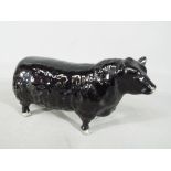 Beswick Pottery - a figurine in the form of an Aberdeen Angus Bull