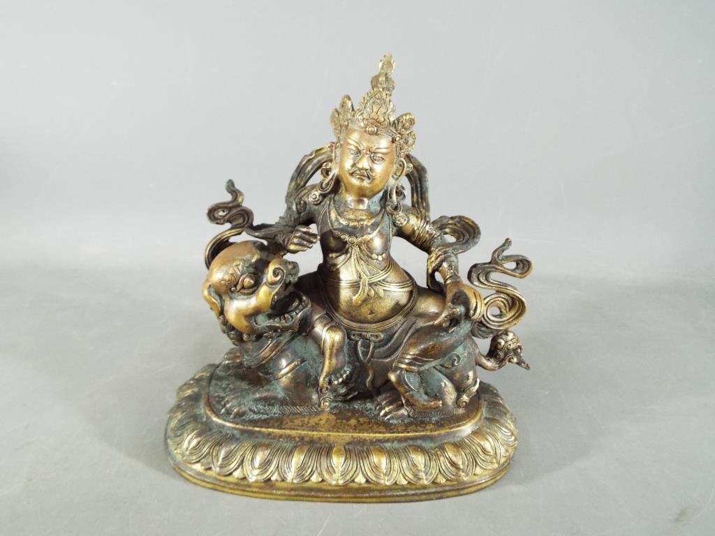 Buddha - An 18th / 19th century Chinese Tibetan gilt bronze Buddhist figure depicting Jambhala