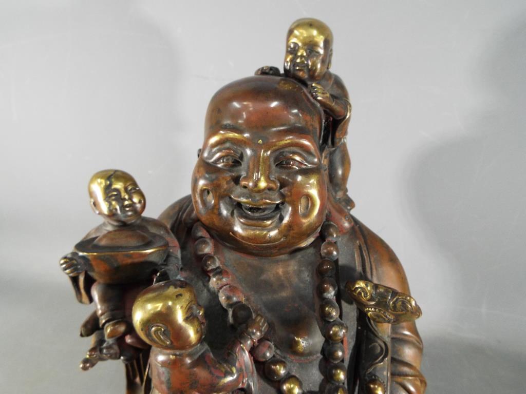 A large Chinese gilt bronze laughing Buddha with five children holding Ruyi sceptre, - Image 3 of 8