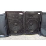 Kam - A pair of Kam ZP series speakers with protective covers.