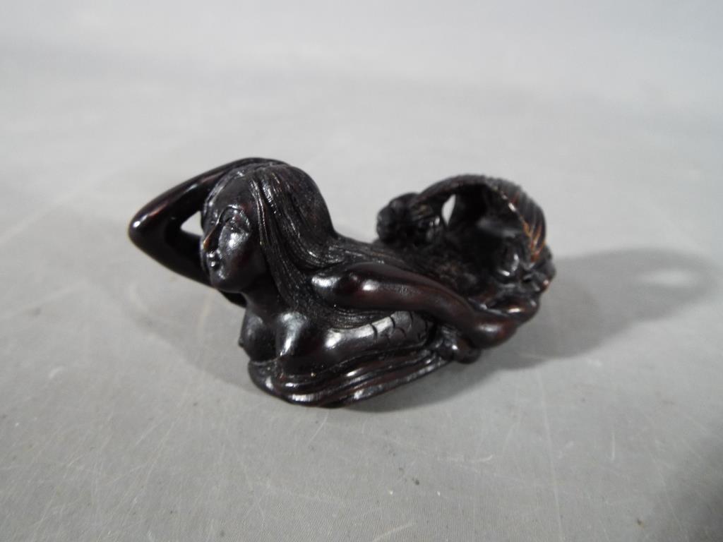 A vintage Japanese dark wood Netsuke depicting an Owl seated on a thick branch or log, - Image 3 of 7