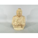 A carved stone Buddhist deity,