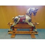 An early 20th century rocking horse by Baby Carriages, Liverpool,