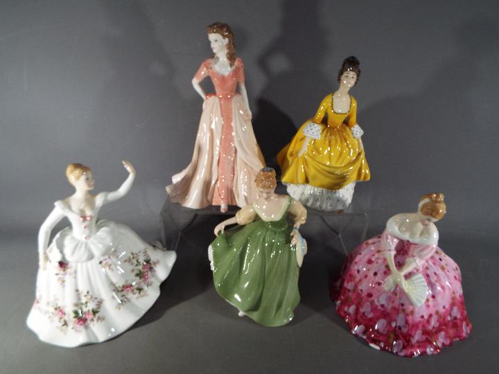 Five ceramic lady figurines,