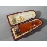 A late Victorian cheroot holder with 9 carat gold mount, Birmingham assay 1899,